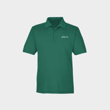 Green polo shirt with Golfista logo on a light gray background