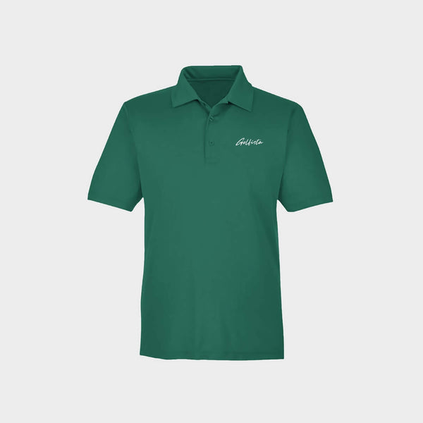 Green polo shirt with Golfista logo on a light gray background