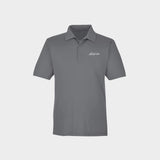 Gray polo shirt with Golfista logo on a light gray background