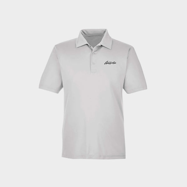 White polo shirt with Golfista logo on a light gray background