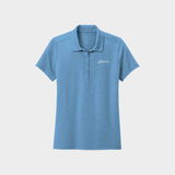 Light Blue polo shirt with Golfista logo on a light gray background