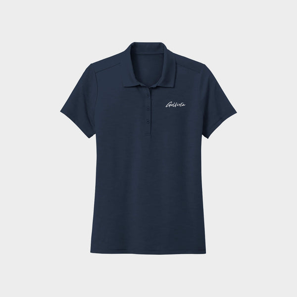 Navy blue polo shirt with Golfista logo on a light gray background