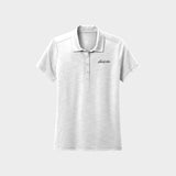 White polo shirt with Golfista logo on a light gray background