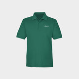 Green polo shirt with Golfista logo on a light gray background